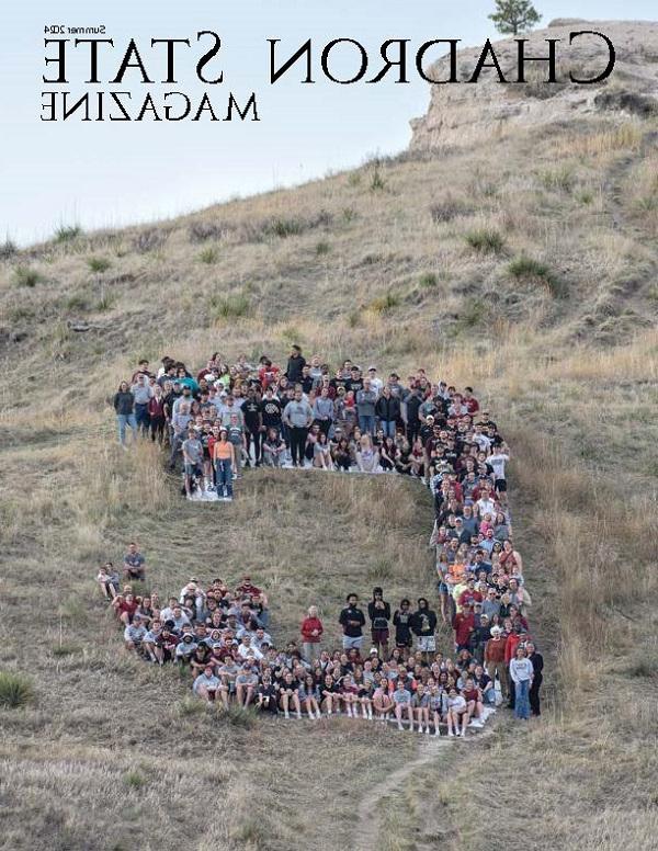 Cover of the summer 2024 Chadron State Magazine, image shows peopl standing on the C on C-Hill